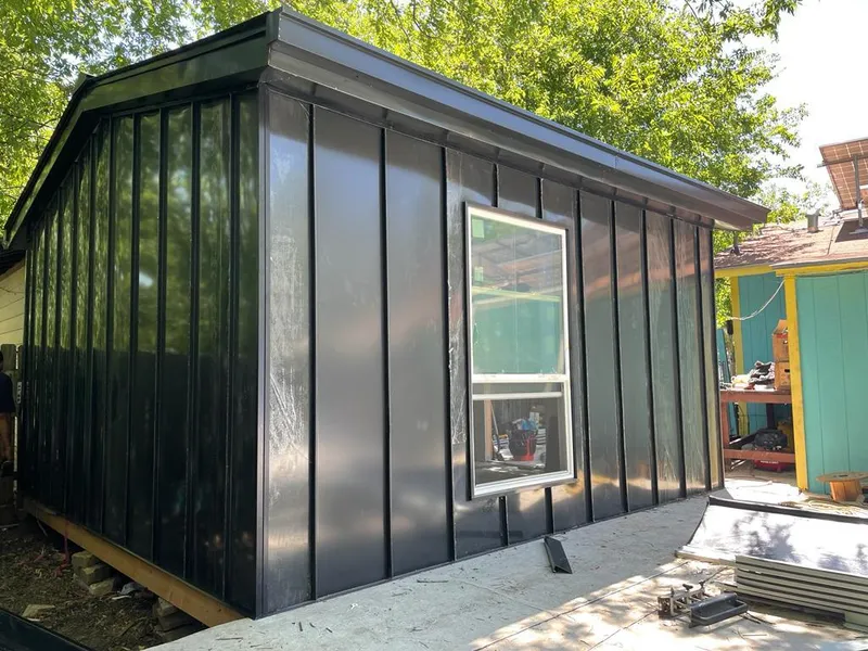 Black standing seam metal wall panels for Roof Inspection in Wilsonville