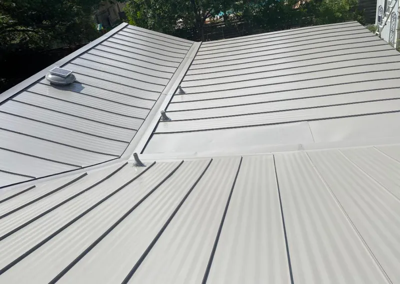 Solar attic fan installed on a metal roof for Roof Ventilation in Wilsonville